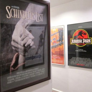 The hallway towards the restroom filled with posters of Spielberg's movies 
