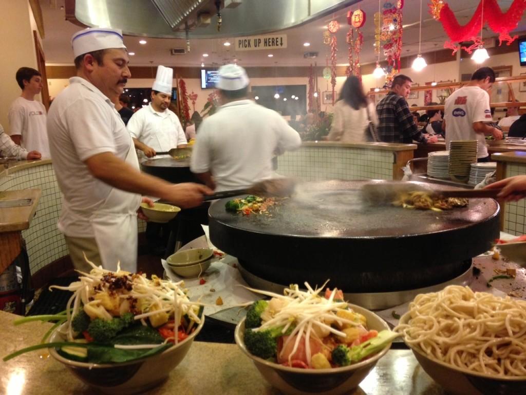 The big stoves called "woks" that you walk around while waiting for your food to be cooked