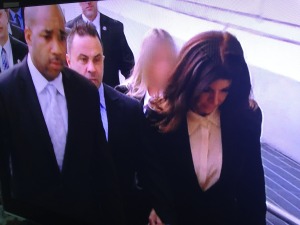 Teresa and Joe Giudice from the Real Housewives of New Jersey being escorted to court.