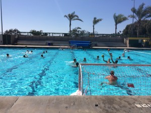 Varsity water polo shooting during practice. 
